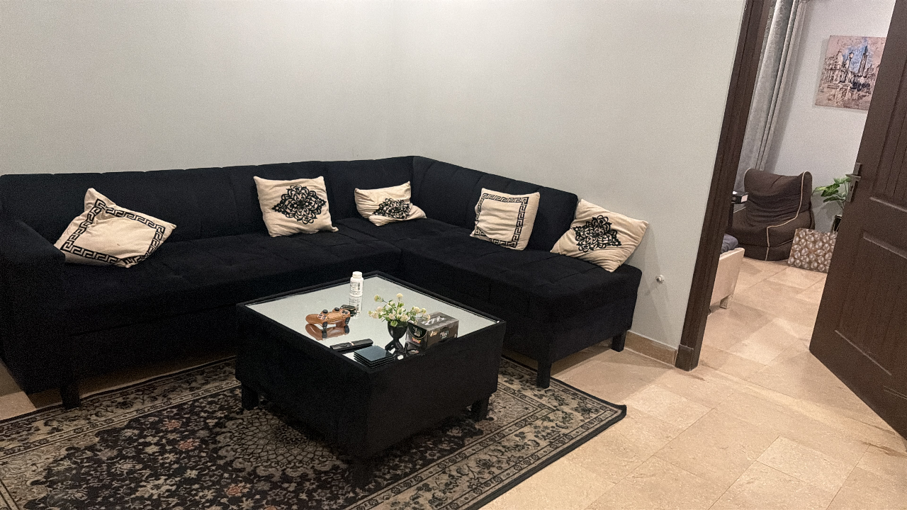 L shaped sofa with mirror table